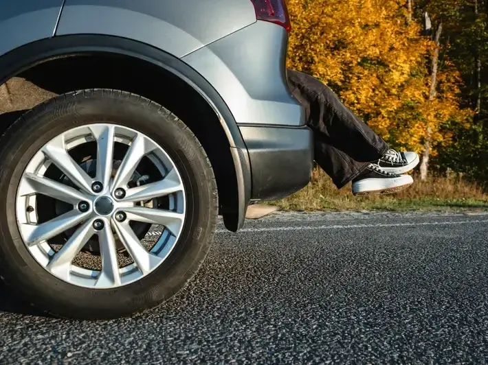 Attorney investigating hit and run pedestrian death claim on a wide Mesa arterial road